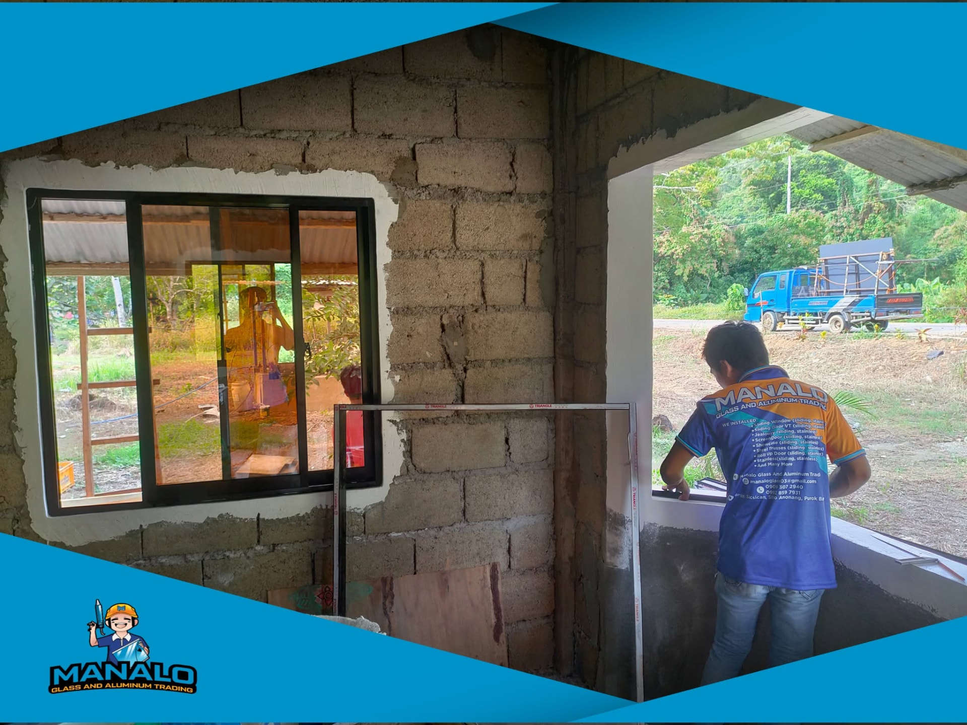 Installer fitting a black aluminum sliding window